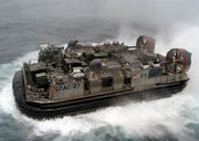 A US Navy LCAC hovercraft attached to the Amphibious assault ship USS Kearsarge