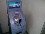 An ATM with card reader and PIN keypad.