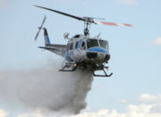 Kern County (California) Fire Department Bell 205 dropping water on fire