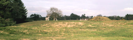 Mound 11 (front left), Mound 10 (foreground, masking Mound 1), Mound 2 (middle distance) and Sutton Hoo House, coachhouse and stables: looking north.
