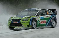 Marcus Grönholm driving the Ford Focus RS WRC 06 in 2006.
