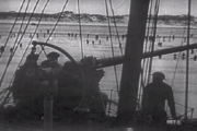 Royal Navy gunner covering retreating troops at Dunkirk (1940).
