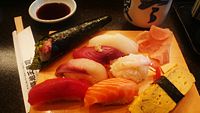 Many types of sushi ready to be eaten.
