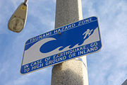 Tsunami hazard sign at The Wedge in Balboa Peninsula, Newport Beach, California.