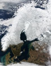 Satellite image of Scandinavia in winter. The Gulf of Bothnia and White Sea are covered with sea ice.