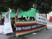 Protestors against the Mugabe regime abroad; protests are discouraged by Zimbabwean police in Zimbabwe