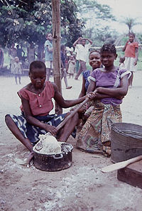 Young women preparing fufu