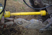 A PTO shaft connected to a tractor.