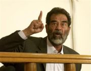 Saddam Hussein at his appearance before the Iraqi Special Tribunal on July 1, 2004; he went on trial in Baghdad for crimes against humanity on October 19, 2005