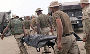 A US marine killed in April 2003 is carried away after receiving his last rites.