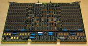 A four-megabyte RAM card measuring about 56 by 38 centimeters (twenty-two by fifteen inches); made for the VAX 8600 minicomputer (ca. 1986). Dual in-line package (DIP)  Integrated circuits populate nearly the whole board; the RAM chips are the most common kind, and located in the rectangular areas to the left and right.