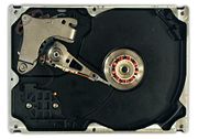 Internals of a Winchester hard drive with the disks removed.
