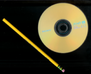 Size comparison: A 12 cm Sony DVD+RW and a 19 cm pencil.