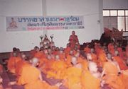 The abbot of a Buddhist monastery instructing novices, Uttaradit, Thailand.
