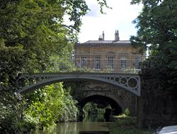 Cleveland House and the cast iron bridges of Sydney Gardens over the Kennet and Avon Canal