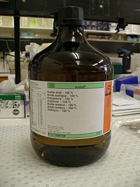 2.5-litre bottle of acetic acid in a laboratory.