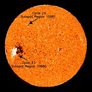 A sunspot of cycle 23 (equator) and first sunspot of cycle 24 (top). (January 4, 2008)  Cycle 23 sunspots are expected to continue to appear for several months in 2008.