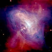 This composite image shows X-ray (blue) and optical (red) radiation from the Crab Nebula's core region. A pulsar near the center is propelling particles to almost the speed of light. This neutron star is travelling at an estimated 375 km/s. NASA/CXC/HST/ASU/J. Hester et al. image credit.