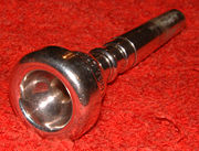 Trumpet mouthpiece assembly showing the rim, cup, and backbore