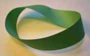 A Möbius strip, an object with only one surface and one edge; such shapes are an object of study in topology.