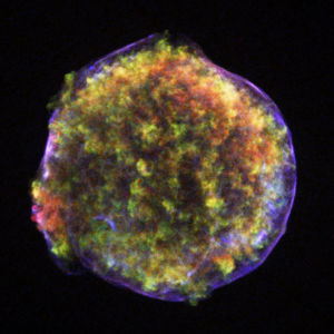 The remnant of "Tycho's Supernova", a huge ball of expanding plasma. The blue outer shell arises from X-ray emission by high-speed electrons.