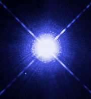Image of Sirius A and Sirius B taken by the Hubble Space Telescope. Sirius B, which is a white dwarf, can be seen as a faint dot to the lower left of the much brighter Sirius A.