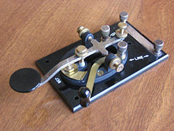 A typical "straight key." This U.S. model, known as the J-38, was manufactured in huge quantities during World War II, and remains in widespread use today. In a straight key, the signal is "on" when the knob is pressed, and "off" when it is released. Length and timing of the dits and dahs are entirely controlled by the operator.