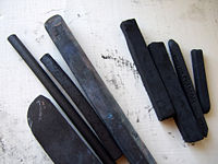 Sticks of vine and compressed charcoal.
