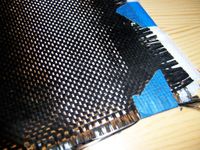 A cloth of woven carbon filaments