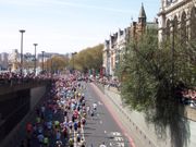 Runners surge out of the Blackfriars Bridge underpass onto the Victoria Embankment; two miles to go