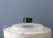 A magnet levitating above a high-temperature superconductor demonstrates the Meissner effect.