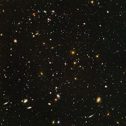 Distant galaxies in deep space in a Hubble Ultra Deep Field photograph