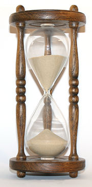 The flow of sand in an hourglass can be used to keep track of elapsed time. It also concretely represents the present as being  between the past and the future.
