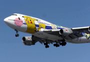 The ANA Boeing 747-400 airplane painted with Pikachu and other Pokémon.