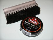 Shoe polish with a shoe brush