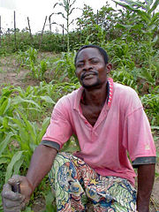Congolese farmer with his crops