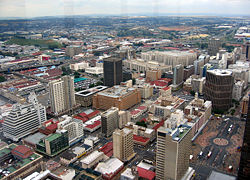 Marshalltown, as seen from the top of the Carlton Centre. The M1 and M2 run behind the buildings, and the southern suburbs extend past the highway boundary.