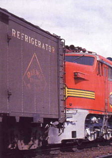 An REA express reefer is positioned at the head end of Santa Fe train No.8, the Fast Mail Express, in 1965.