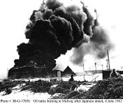 Burning oil tanks on Sand Island during the Battle of Midway.