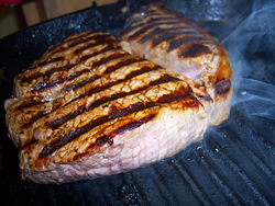 Beef rump steak on grill pan, cooked to medium rare