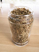 A pot of dried tarragon leaves