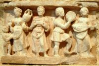 Hellenistic culture in the Indian subcontinent: Greek clothes, amphoras, wine and music (Detail from Chakhil-i-Ghoundi stupa, Hadda, Gandhara, 1st century CE).
