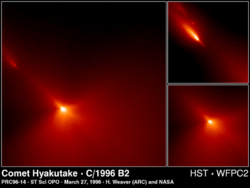 The region around the nucleus of Comet Hyakutake, as seen by the Hubble Space Telescope. Some fragments can be seen breaking off.