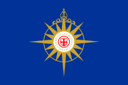 The Anglican Communion uses the compass rose as its symbol, signifying its worldwide reach and decentralized nature. It is surmounted, like ecclesiastical coats of arms, by a bishop's mitre; in the centre is a cross of St. George recalling the communion's origins in the Church of England. The Greek motto, Ἡ ἀλήθεια ἐλευθερώσει ὑμᾶς ("The truth will set you free") is a quotation from John 8:32.  It was designed by Edward Nason West, Canon of the Cathedral of St. John the Divine in New York City.