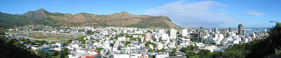 A panoramic view of Port Louis showing the Champ de Mars Racecourse (left) and the city centre (right).