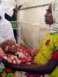 This mother had just arrived with her sick baby at Abu Shouk IDP camp in North Darfur.