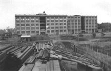 A photo of the warehouse taken after the battle. Note the flag still flying over the warehouse.