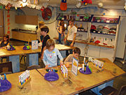 At the Buell Childrens Museum in Pueblo, Colorado, children and their guardians partake in arts and crafts.