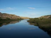 The Red Deer River near Drumheller, Alberta. Almost three-quarters of all Albertosaurus remains have been discovered alongside the river, in outcrops like the ones on either side of this picture.