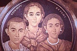 A group portrait depicted on glass, dating from c.250 A.D., showing a mother, son and daughter. It was once considered to be a depiction of the family of Valentinian III.